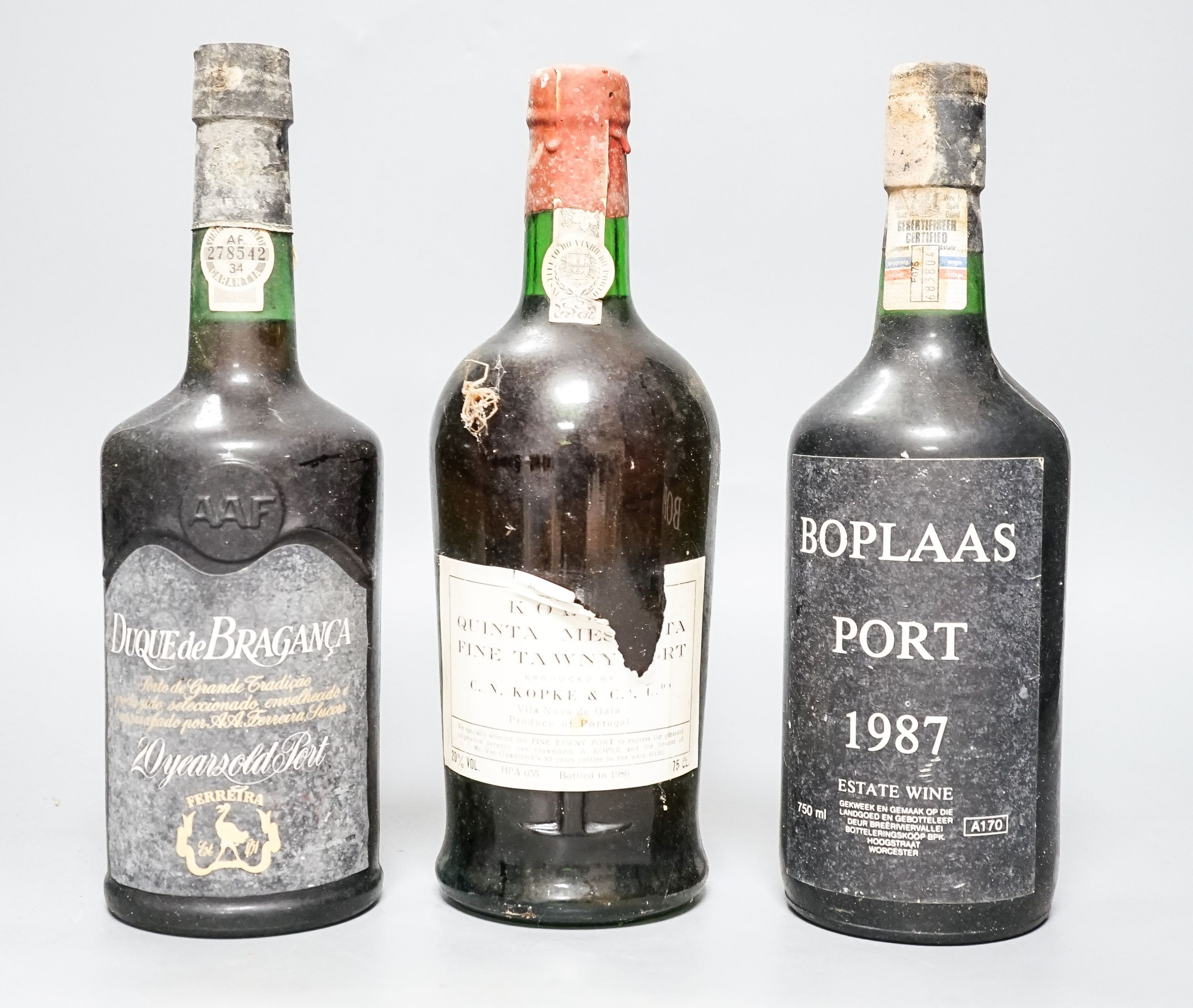 13 various bottles of port including Taylor’s 1976, Taylor’s 1960, Boplaas 1987, Cockburns 1963 etc.